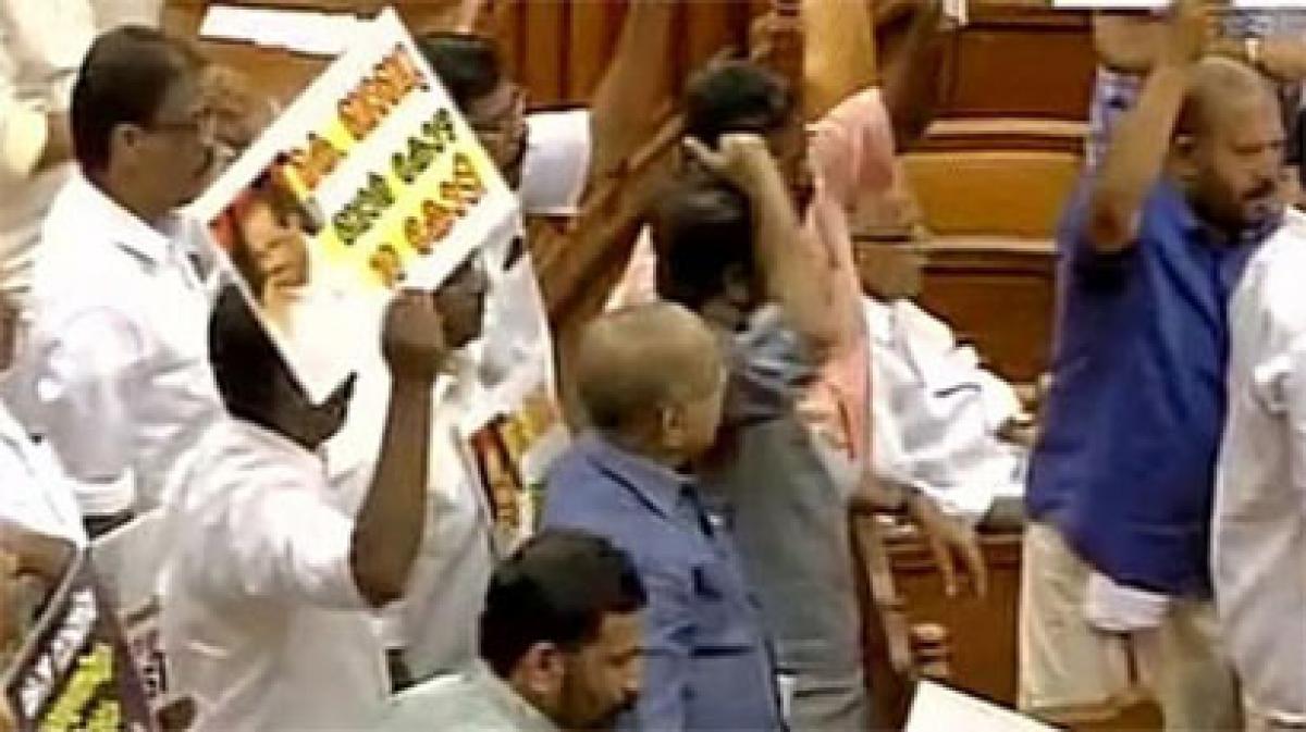 Kerala Chief Minister presents budget amid protests over scams by Opposition